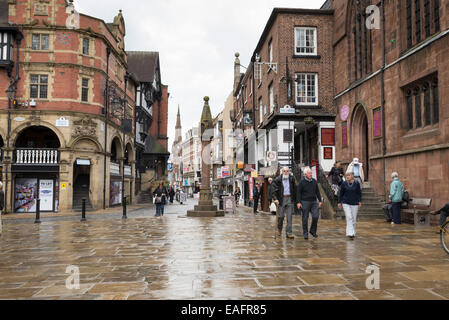 CHESTER, UK - JUNE 9,2014: City centre shopping in the historic centre of Chester. The Cross marks the centre of the Roman city. Stock Photo