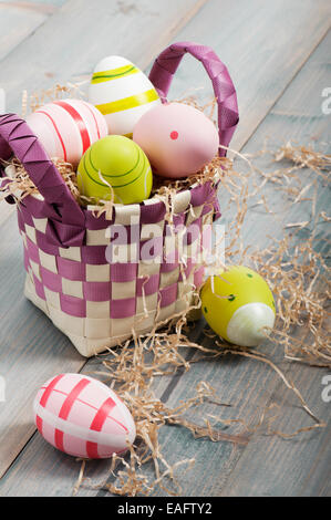 colorful easter eggs in basket Stock Photo