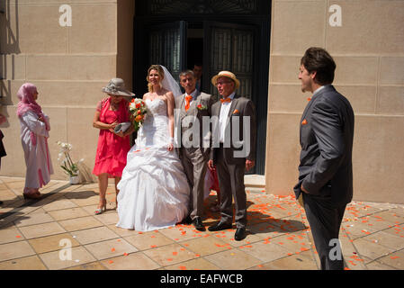 French wedding official photograph in front of the Hotel de Ville, Nice, France. Stock Photo