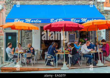 Tourists seated in a street cafe, Vernazza, Cinque Terre, Liguria, Italy Stock Photo