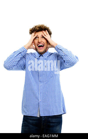 Portrait of crazy young man standing on a white background Stock Photo
