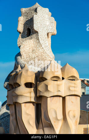Chimneys or ventilation towers on the rooftop of Casa Mila or La Pedrera, Barcelona, Catalonia, Spain Stock Photo