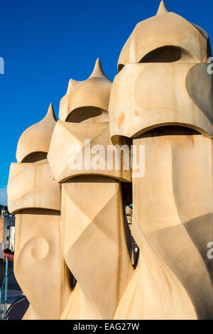 Chimneys or ventilation towers on the rooftop of Casa Mila or La Pedrera, Barcelona, Catalonia, Spain Stock Photo