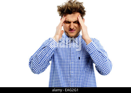 Young man having headache over white background Stock Photo