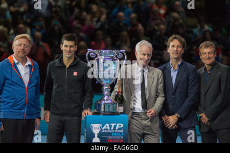 O2 arena, London, UK. 14th November, 2014. Novak Djokovic has clinched the year-end No. 1 Emirates ATP Ranking for a third time. Novak Djokovic stands beside the cup with his head coach, Boris Becker, to one side and other former No. 1 players John McEnroe, Carlos Moya and Matts Willander to the right. Credit:  Malcolm Park editorial/Alamy Live News Stock Photo