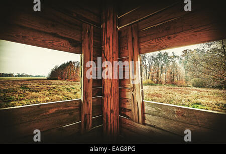 Retro filtered interior of hunting tower in autumn season. Stock Photo