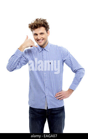 Young casual man showing call me gesture, Communicati on Stock Photo