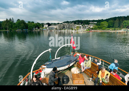 LAKE WINDERMERE, CUMBRIA, ENGLAND - JUNE 9, 2014: People in Teal ship at Lake District National Park in Lake Windermere, Cumbria Stock Photo