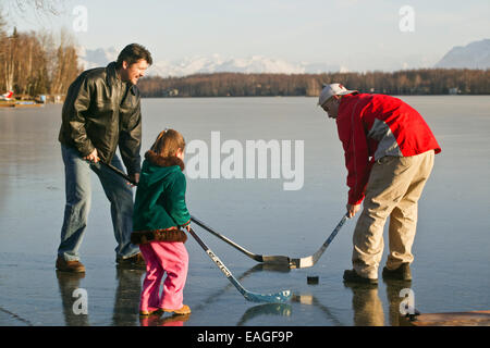 Sarah Palin's Husband Todd Plays Hockey With Their Children Track And Piper On Frozen Lake Lucille In Wasilla, Alaska 2005 Stock Photo