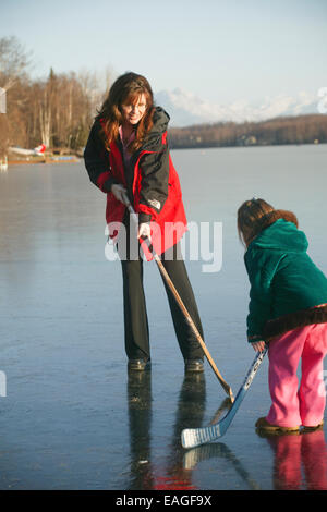 Sarah Palin Plays Hockey With Daughter Piper On Frozen Lake Lucille In Wasilla, Alaska 2005 Stock Photo