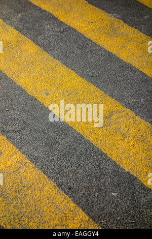 yellow stripes on the asphalt of a parking lot Stock Photo