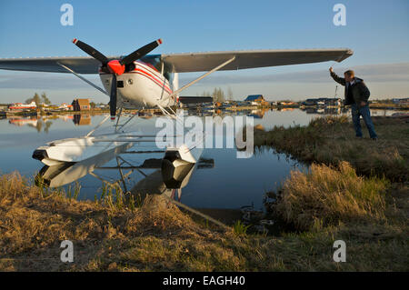 Pilot Prepares His Plane For Flight At Lake Hood In Anchorage, Alaska Stock Photo