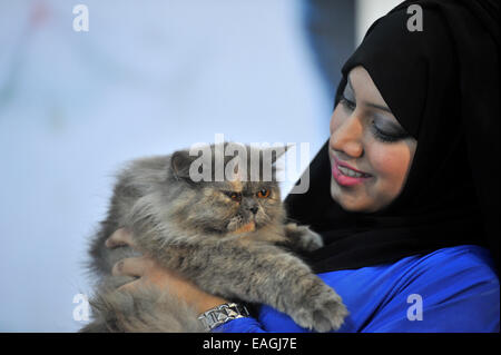 Cat owner proudly shows her pet. Cat Association of Bangladesh organized cat show at National Press Club in Dhaka. Native and foreign domestic cat was displayed. © Mohammad Asad/Pacific Press/Alamy Live News Stock Photo