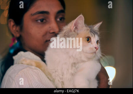 Cat owner proudly shows her pet. Cat Association of Bangladesh organized cat show at National Press Club in Dhaka. Native and foreign domestic cat was displayed. © Mohammad Asad/Pacific Press/Alamy Live News Stock Photo