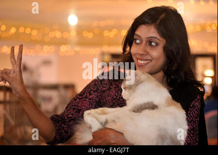 Cat owner proudly shows her pet. Cat Association of Bangladesh organized cat show at National Press Club in Dhaka. Native and foreign domestic cat was displayed. © Mohammad Asad/Pacific Press/Alamy Live News Stock Photo