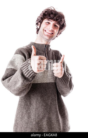 an handsome guy, maybe a student, in casual clothing with thumbs up. isolated over white Stock Photo