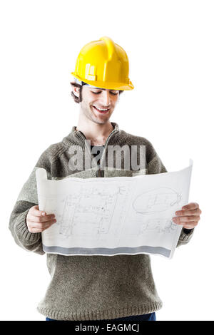 an handsome architect or engineer wearing a hard hat and carrying some construction plans. isolated on white Stock Photo