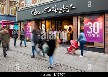 Shoppers enjoying the various discounts & sale offers in stores along Market Street, Manchester, UK Stock Photo
