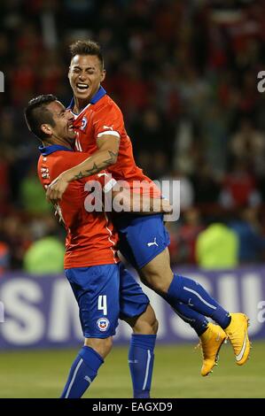 Talcahuano, Chile. 14th Nov, 2014. Image provided by the National Asociation of Professional Soccer shows Chile's Eduardo Vargas (R) celebrating with teammate Mauricio Isla during a friendly match with Venezuela in Talcahuano, Chile, Nov. 14, 2014. © ANFP/Xinhua/Alamy Live News Stock Photo