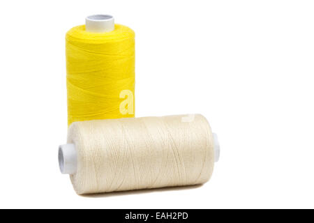 Two bobbins thread isolated over white background Stock Photo