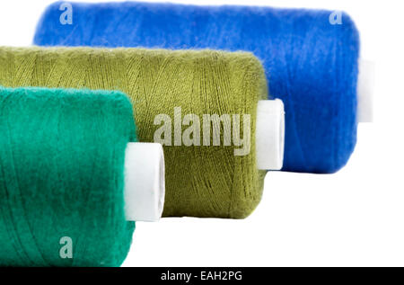 Close up of three thread spools, isolated on white background Stock Photo