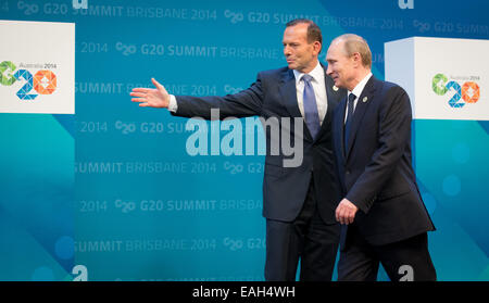Brisbane, Australia. 15th Nov, 2014. Russian President Vladimir Putin (R) welcomed by Australian Prime Minister Tony Abbott at the G20 summit in Brisbane, Australia, 15 November 2014. Brisbane is the center of world politics until 16 November 2014. The summit aims to stimulate growth and employment worldwide. Heads of State will also discuss the fight against the terror militia IS as well as the Ebola epidemic. Photo: KAY NIETFELD/dpa/Alamy Live News Stock Photo