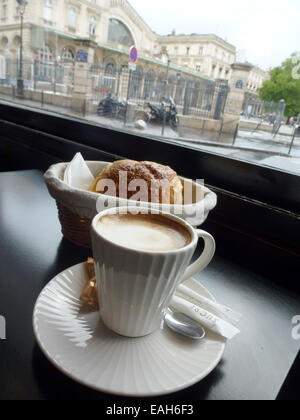 Paris, France. 27th Aug, 2014. A cup of coffee and a croissant on a table at a street cafe at the Gare du Nord in Paris, France, 27 August 2014. Photo: Alexandra Schuler - NO WIRE SERVICE -/dpa/Alamy Live News Stock Photo