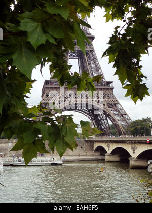 Paris, France. 27th Aug, 2014. A view of the Eiffel Tower through branches in Paris, France, 27 August 2014. Photo: Alexandra Schuler - NO WIRE SERVICE -/dpa/Alamy Live News Stock Photo