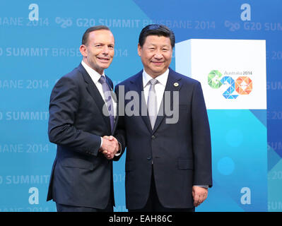 Brisbane, Australia. 15th Nov, 2014. Chinese President Xi Jinping (R) is welcomed by Australian Prime Minister Tony Abbott at the 9th Group of 20 (G20) Summit in Brisbane, Australia, Nov. 15, 2014. Credit:  Ding Lin/Xinhua/Alamy Live News Stock Photo