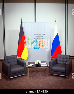 Brisbane, Australia. 15th Nov, 2014. Empty chairs and the flags of Germany and Russia in a conference room at the G20 summit in Brisbane, Australia, 15 November 2014. Merkel and Putin have met for a private conversation in this hotel. Photo: KAY NIETFELD/dpa/Alamy Live News Stock Photo