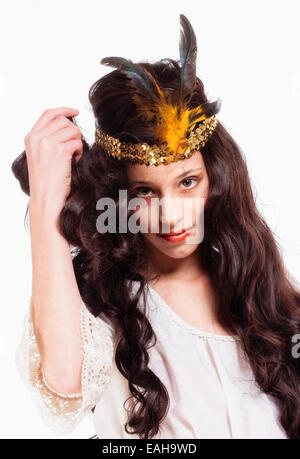 Portrait of a Young Girl Wearing a Diadem with Feathers Stock Photo