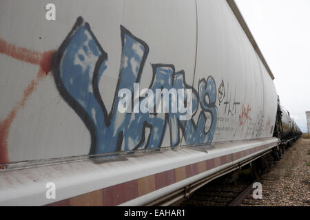 freight grain trucks on canadian pacific railway through assiniboia Saskatchewan Canada Stock Photo