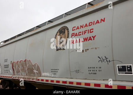 freight grain trucks on canadian pacific railway Saskatchewan Canada Stock Photo