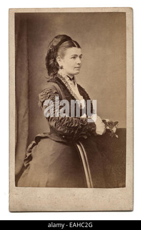 Victorian carte-de-visite, portrait of a young woman. Taken in the studio of Richard Upjohn, London, circa 1885 Stock Photo