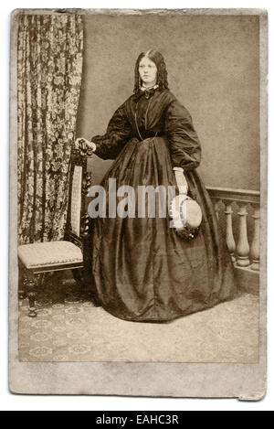 Victorian carte-de-visite, portrait of a young woman from the Hawkins’s studio Cheltenham, UK circa 1865 Stock Photo