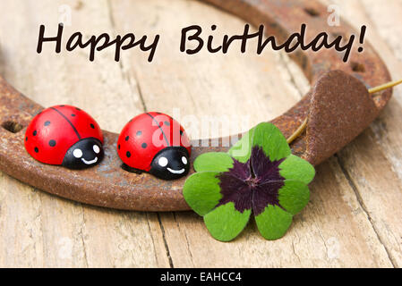 Birthday Card with horseshoe, Leafed clover and ladybugs Stock Photo