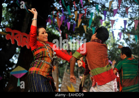 Artists prepare food  during the 'Nabanna Festival' in Dhaka.  'Nabanna' or the new time crop is a popular festival in Bangladesh which is celebrated every  first day of bangle month Agrahayon. (Photo by Mohammad Asad / Pacific Press) Stock Photo