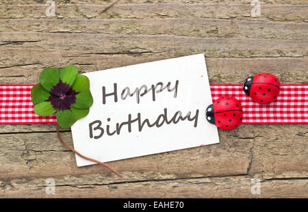 english Birthday card with Leafed clover and ladybugs Stock Photo