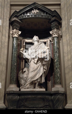 Statue of John the Evangelist the apostle into a niche in the Archbasilica of St. John Lateran, Rome Italy Stock Photo