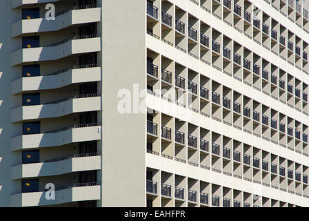 Abstract Architecture: A geometric pattern is created by highlights and shadows of the outdoor patios of a cement building. Stock Photo