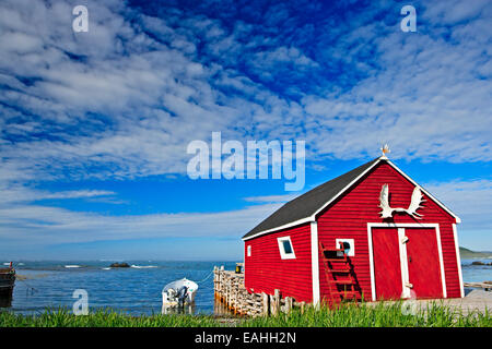 A red fishing stage in the town of L'Anse aux Meadows, Northern Peninsula, Viking Trail, Newfoundland Labrador, Canada. Stock Photo