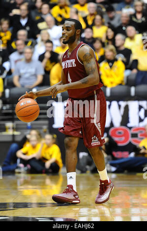 Wichita, Kansas, USA. 14th Nov, 2014. New Mexico State Aggies guard Ian Baker (4) sets up the offense during the NCAA Basketball game between the New Mexico State Aggies and the Wichita State Shockers at Charles Koch Arena in Wichita, Kansas. Kendall Shaw/CSM/Alamy Live News Stock Photo