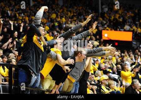 Wichita, Kansas, USA. 14th Nov, 2014. Shocker fans yell encouragement to their team during the NCAA Basketball game between the New Mexico State Aggies and the Wichita State Shockers at Charles Koch Arena in Wichita, Kansas. Kendall Shaw/CSM/Alamy Live News Stock Photo