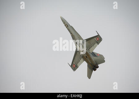 Fairford, UK - 12 July 2014: Swiss Airforce F18 Hornet fighter aircraft in flight and displaying at the Royal International Air Stock Photo