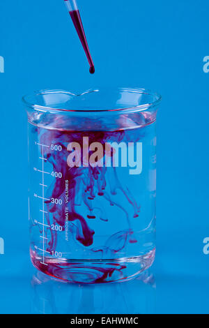 Beaker Food Coloring Rwd Red food coloring dropped into a Beaker of water Stock Photo - Alamy