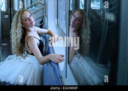 Classic ballerina with tutu dancing in the New York Subway.   Classic ballerina with tutu dancing in the New York Subway. Stock Photo