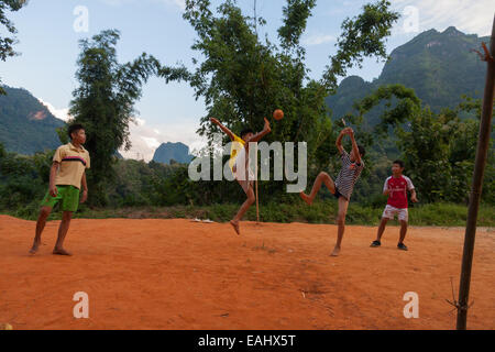 Acrobatic kids playing rattan ball Stock Photo