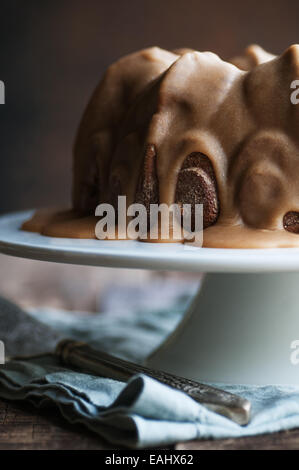 Delicious spice bundt cake with caramel frosting Stock Photo