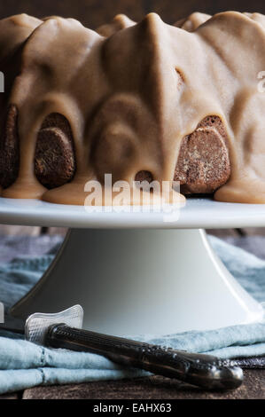 Delicious spice bundt cake with caramel frosting Stock Photo