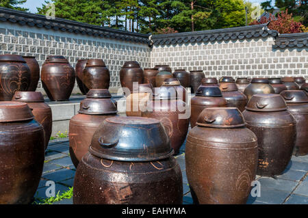 Dozens of large clay pots hold fermenting kimchi in Seoul, South Korea. Stock Photo